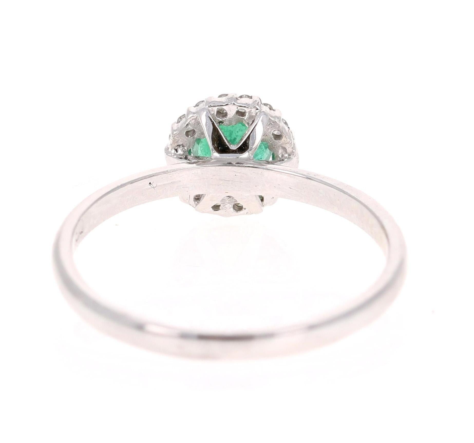 0.64 Carat Emerald Diamond White Gold Cluster Ring